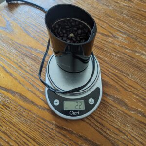 spice grinder full of coffee beans